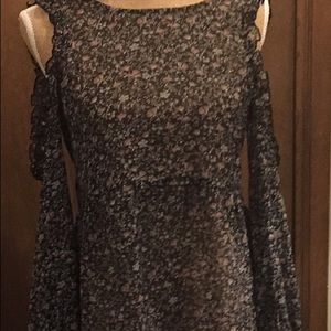 Floral long sleeve, cold shoulder blouse.